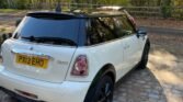 This 2010 Mini Hatch Cooper is a 3-door hatchback with a grey exterior and white colour interior. The car has had 3 previous owners and has a mileage of 82