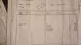 A stack of documents is shown with an invoice from John Title Car Repairs Ltd on top. The invoice, dated 7th October 2020, details a bill for MINI car repair services including checks and parts like an oil filter and brake fluid. The total amount due is £204.21.