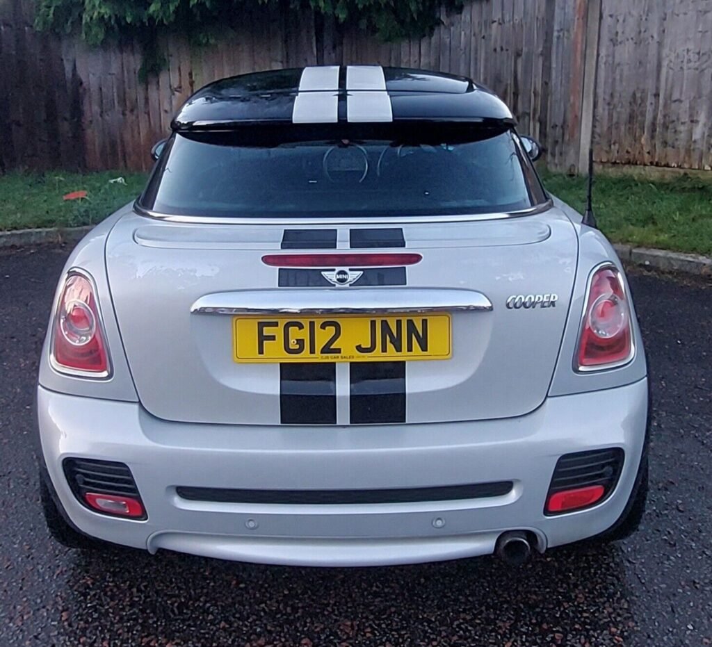 This Mini Cooper S JCW Coupe is sure to turn heads with its sleek silver exterior and black leather interior. With only 5 previous owners and a mileage of 98550