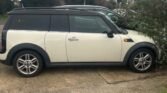 This Mini Cooper Clubman 1.6 Diesel has a sleek white exterior and a spacious estate body type with five seats. It has had seven previous owners and a low mileage of only 65