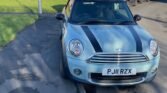 This blue Mini One Convertible has been registered overseas before with three previous owners and a mileage of 84000. The car has a manual transmission and a 1598cc petrol engine. The convertible has four seats and two doors