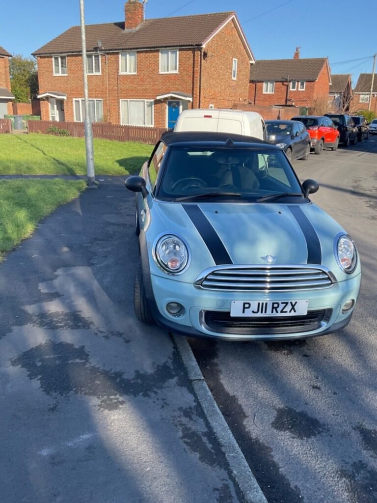 This blue Mini One Convertible has been registered overseas before with three previous owners and a mileage of 84000. The car has a manual transmission and a 1598cc petrol engine. The convertible has four seats and two doors