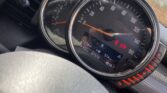 Close-up of a MINI car dashboard showing two large circular gauges. The left gauge is a tachometer, while the right gauge is a speedometer reading 44 km/h. Below the gauges, a digital display shows time (11:14 AM), temperature (4°C), odometer (37874 km), and fuel range (374 km).