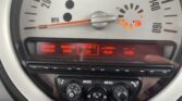 A mini car speedometer shows the needle at 0 MPH and warning lights on near the nearly empty fuel gauge. Below, a digital display lists TUNER, DAB, “Insert CD”, AUX, and USB, with control buttons and knobs underneath—perfect for any mini trader.