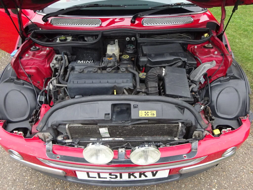 A MINI Cooper engine bay, where servicing and the bigger repair jobs happen